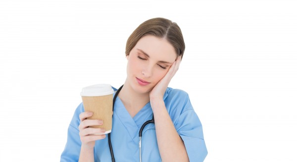 tired nurse with coffee